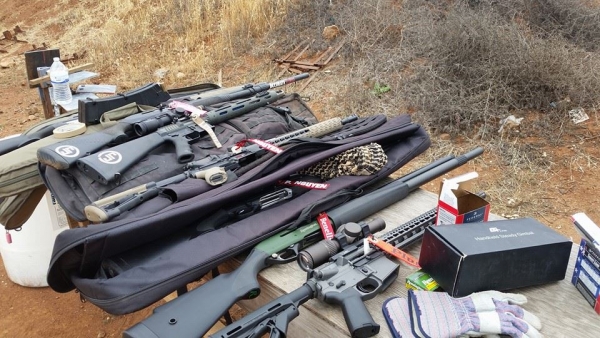 Firearms at the range using Plug'r chamber flags as empty chamber indicators.